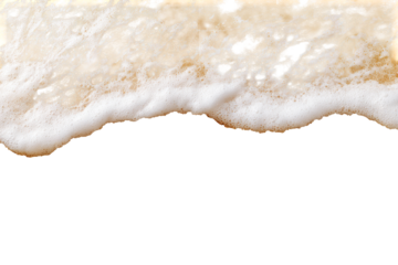Foamy waves on light beige sand