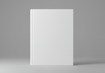 A sleek hard cover book mockup, bathed in the soft glow of a grey backdrop, ready to showcase its cover design