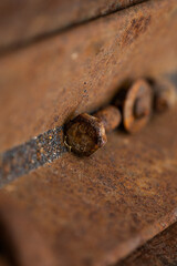 Close-up of a rusted metal surface with a crack. aged iron background.