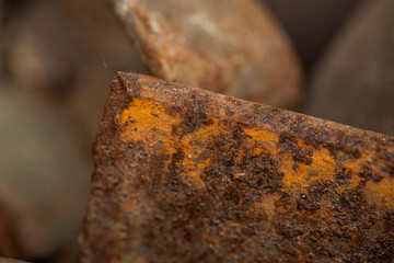 Close-up of a rusted metal surface with a crack. aged iron background.