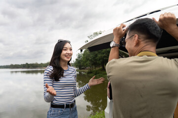 Couple enjoying a scenic moment by the lake