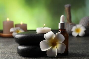 Composition with spa stones on grey table, closeup