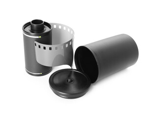 Roll of photographic film and canister isolated on white