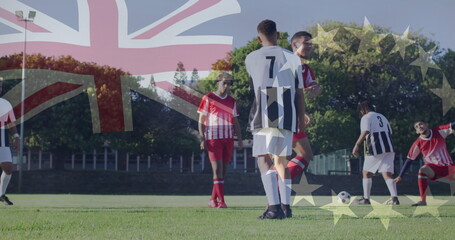Player wearing striped jersey number seven dribbling ball on soccer field, with cleats, goal net