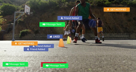 Dribbling player in jersey handling ball on basketball court, with cones, hoop and notifications