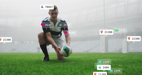 Kneeling rugby player in striped jersey placing rugby ball on pitch at stadium, with floating icons