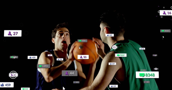 Competing basketball players contesting shot in dark studio, with floating social media icons