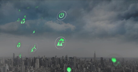Floating green holographic icons hovering above urban skyline, with wind turbine and lightning bolt