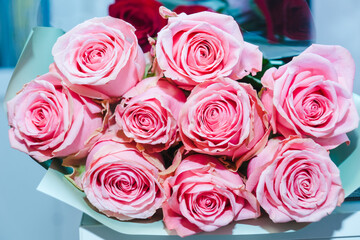 A luxurious bouquet of pink roses. Bunch of many colorful fragrant flowers. Floristry and floral design concept. Floral texture