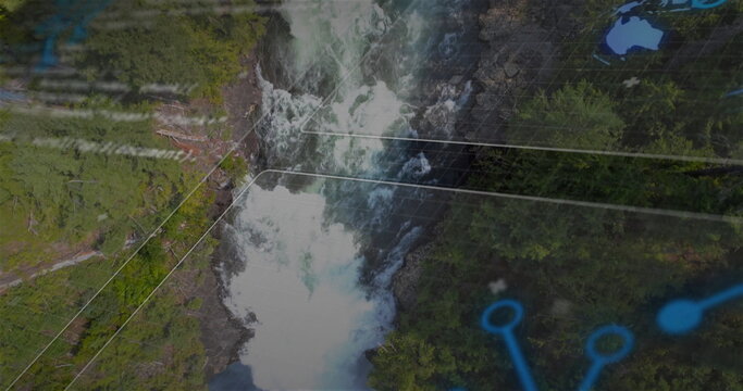 Fototapeta Flowing waterfall cutting through rocky gorge and evergreen forest, with grid lines and blue nodes