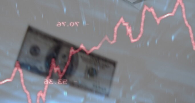 Displaying US dollar bill under red fluctuating line graph on data dashboard, with numeric labels - Powered by Adobe