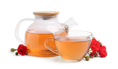 Tasty rose tea in glass cup, teapot and flowers isolated on white