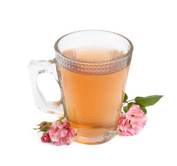 Tasty rose tea in glass cup and flowers isolated on white