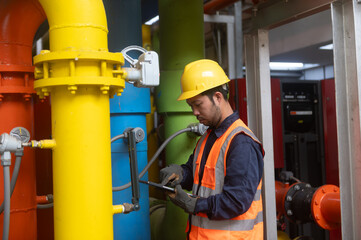 A maintenance engineer is checking the pressure of a gas pipeline in an industrial plant