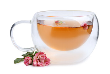 Aromatic tea in glass cup, roses and green leaves isolated on white