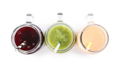 Superfood. Different tasty smoothies in mason jars isolated on white, top view