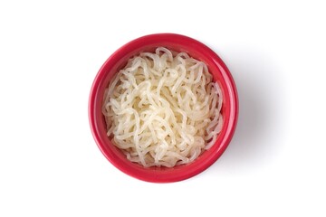 Shirataki noodles  in red  bowl isolated on white background. Seen directly above.