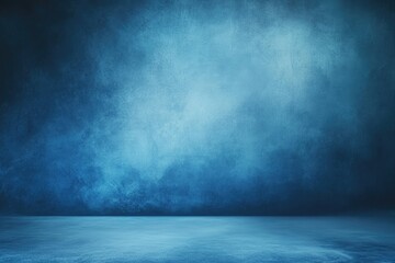 Dark, moody blue studio background with textured wall and floor