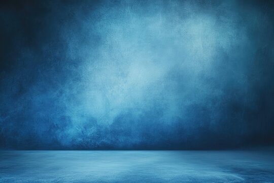 Dark, moody blue studio background with textured wall and floor