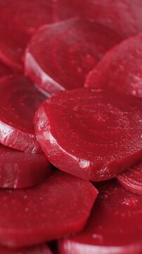 Macro of Cooked Beet Slices Showing Natural Pattern, Vertical Rotation
