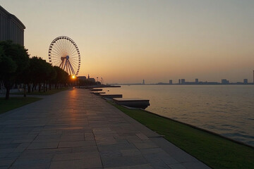 Ferris wheel silhouette against a dusky sky near the water