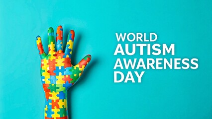Colorful puzzle hand symbol for world autism awareness day