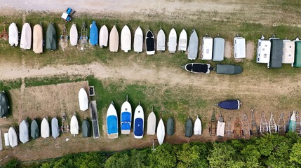 Trailer with boats on a parking space – drone aerial photography