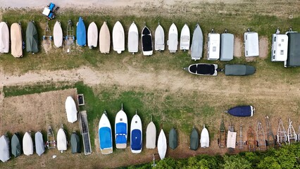 Trailer with boats on a parking space – drone aerial photography