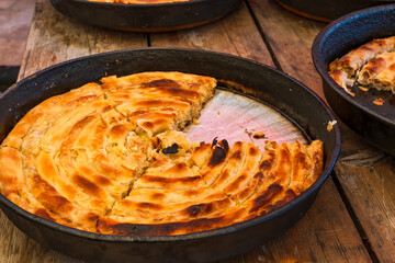 Burek - traditional Bosnian pie stuffed with vegetables, cheese or meat - selective focus