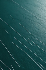 Abstract teal background with diagonal white lines and subtle texture