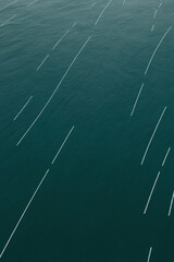 Abstract pattern of white lines on a dark teal background