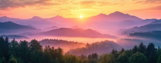 Obraz premium Sunrise over misty mountain ranges (2)