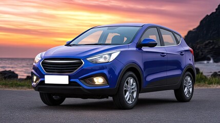 Blue SUV drives along asphalt road near mountains at sunset with sea view, capturing the essence of summer adventure and relaxation
