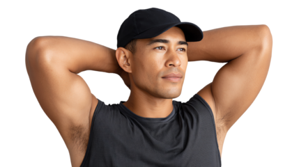 A man in a black cap and sleeveless shirt, relaxing with hands behind head, showcasing confidence and a laid-back attitude.