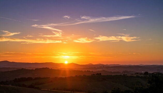 Sunset over rolling hills
