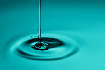 The oil flows and collects into a drop. The texture of the cosmetic product.