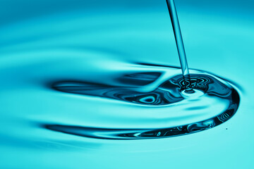 The oil flows and collects into a drop. The texture of the cosmetic product.
