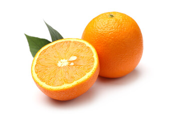 Whole, cut oranges and green leaves isolated on white