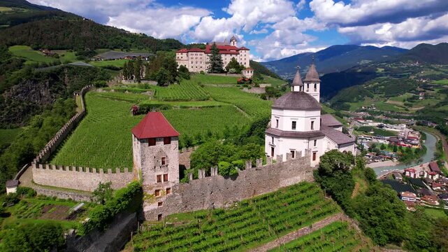 Northern Italy,  Chiusa (Klausen) town aerial view of Sabiona Monastery - one of the most ancient pilgrimage sites of Tyrol. aerial drone video