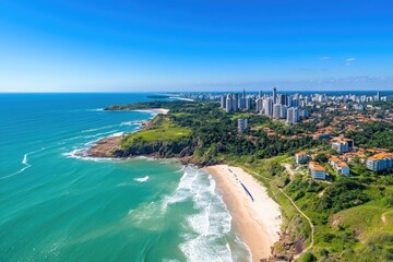 Fototapeta premium Coastal city panorama. Panoramic view of a coastal city with a pristine beach, turquoise waves, and modern high-rise buildings. Green hills and trees cascade down to the sandy shore. Clear blue sky
