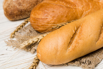 Homemade natural breads. Different kinds of fresh bread as background, perspective view with copy...
