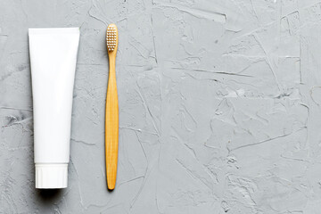 toothpaste and toothbrush top view with copy space on colored background. Flat lay. Dental hygiene....