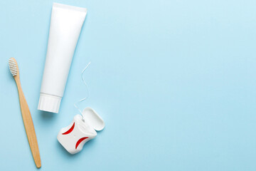 toothpaste and toothbrush top view with copy space on colored background. Flat lay. Dental hygiene....