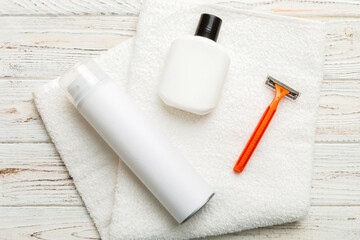 shaving man set. shaving machine, towel, lotion and shaving foam on colored background. Men bath...