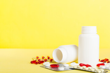 Medicine for treatment HIV infection. Pills and capsules and battle on the table. Different...