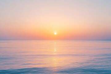 Obraz premium Soft pastel sunrise over a calm sea (1)