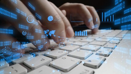 Close-up of hands typing on a keyboard, enhanced by a dynamic digital overlay featuring graphs and a world map, symbolizing data analysis and technology. Xenic