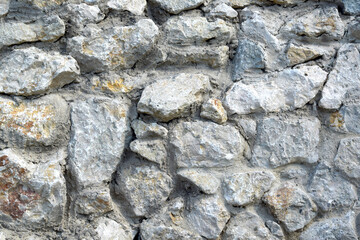Beautiful stone fence and a vineyard on it