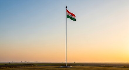 Flag Waving in the Wind During Sunset Over Fields