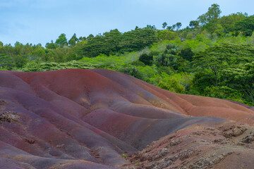 Multi-colored volcanic soil in the Chamarel Natural Park on the island of Mauritius